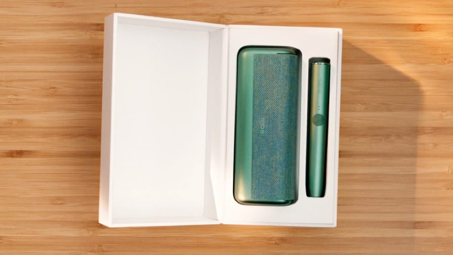 An IQOS ILUMA PRIME Holder and Pocket Charger in a box. 