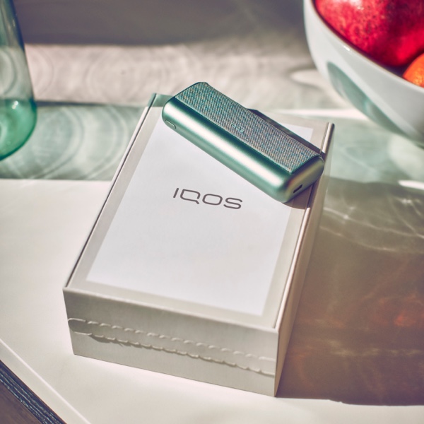 An IQOS box and IQOS Pocket Charger.