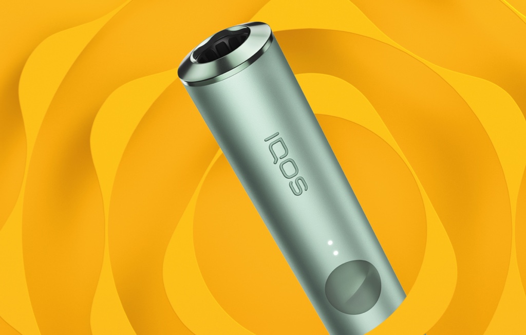 A Jade Green IQOS ILUMA PRIME Pocket Charger and Holder.