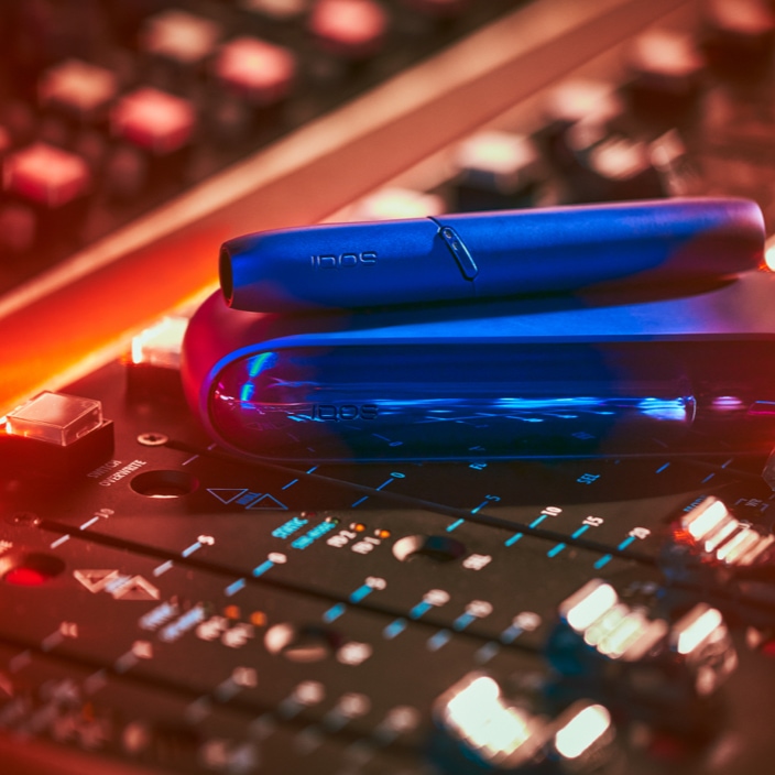 Stellar blue IQOS 3 device on a music production dashboard