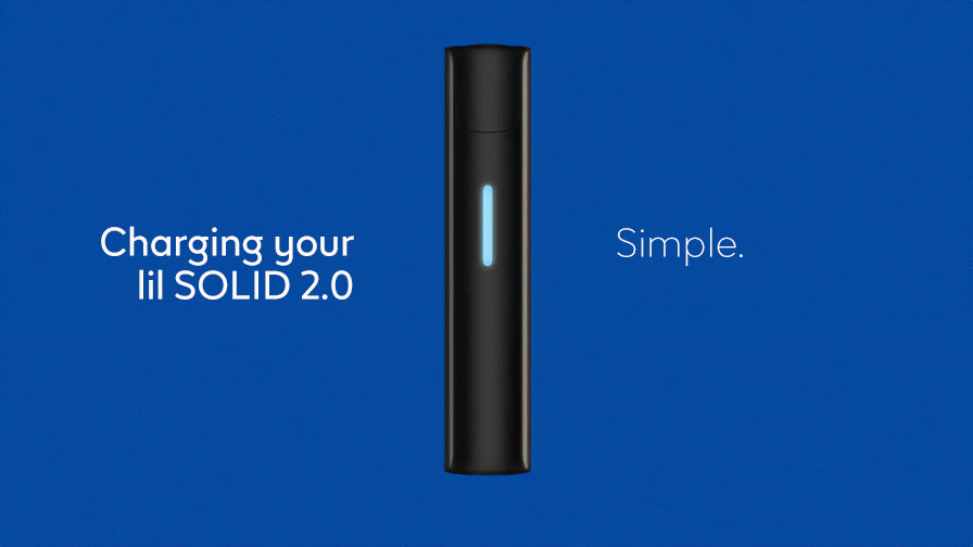 Stone Grey lil SOLID 2.0 device with glowing charging LED light on a blue background