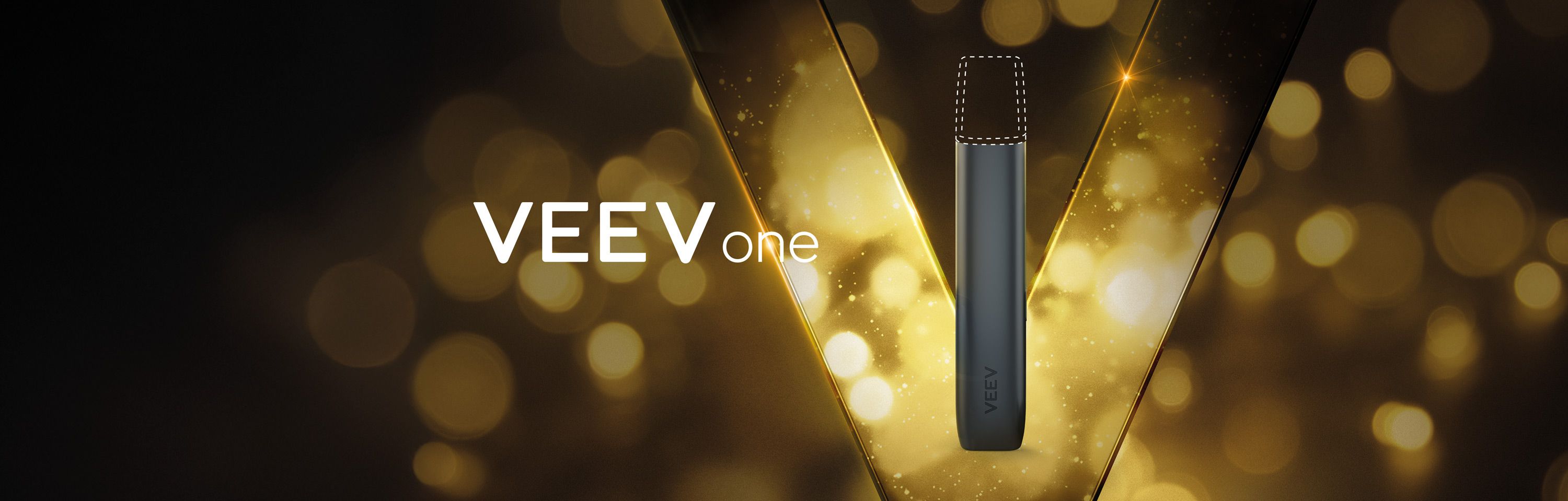 Imagem de um dispositivo VEEV ONE preto sobre um fundo preto com detalhes dourados.