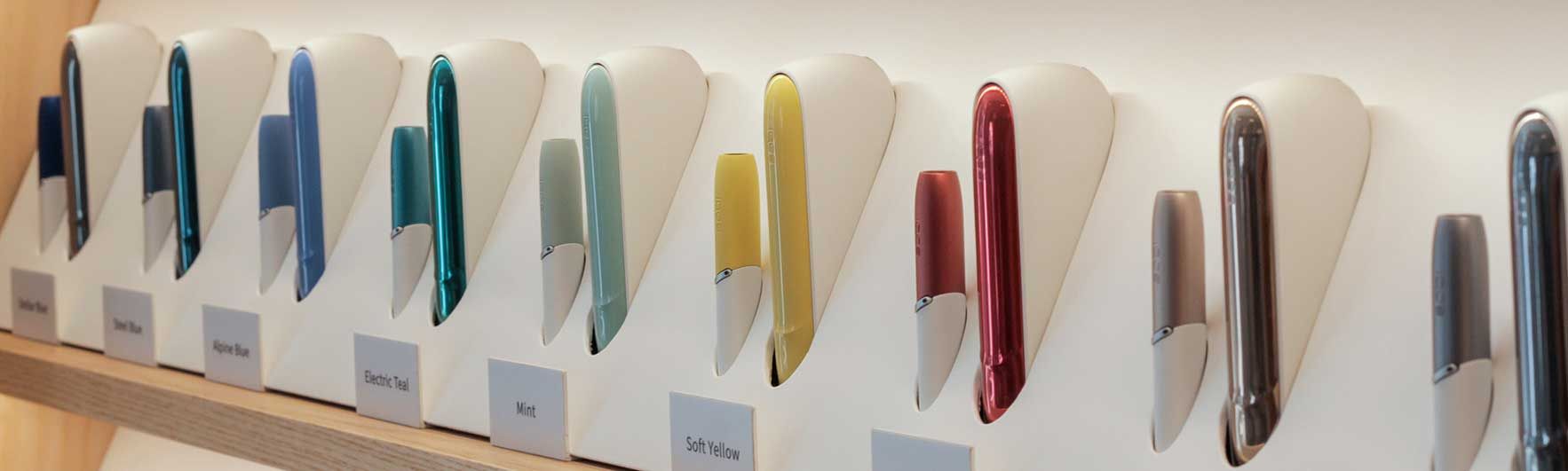 IQOS 3 kit with coloured caps and door covers at an IQOS shop